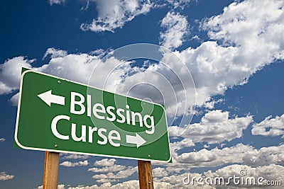 Blessing, Curse Green Road Sign and Clouds Stock Photo