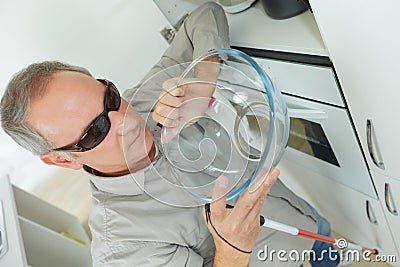 Blind man in kitchen at home Stock Photo