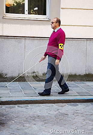 Blind man with stick Stock Photo