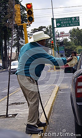 Blind mexican man begs in the street Editorial Stock Photo