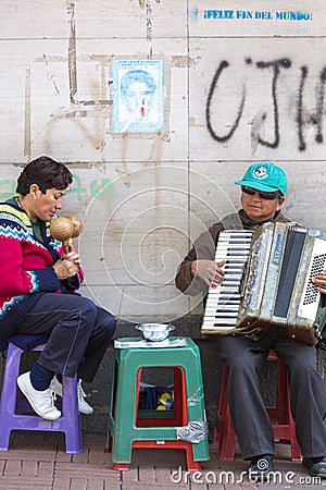 Blind musicians playing music in the street of Quito, Colombia. Editorial Stock Photo