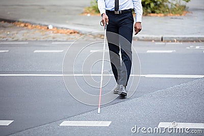 Blind Person Walking On Street Stock Photo