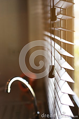 Blind window with warm of sunlighin the kitchen Stock Photo