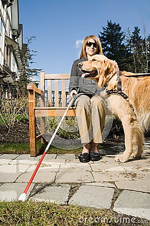 Blind woman with a guide dog Stock Photo