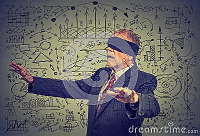 Blindfolded elderly senior business man going through social media data Stock Photo