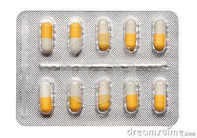 Blister pack of yellow and white capsules isolated on white Stock Photo