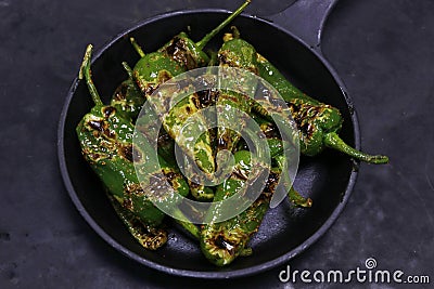 Blistered padron peppers, bar, pub bite food in close up Stock Photo