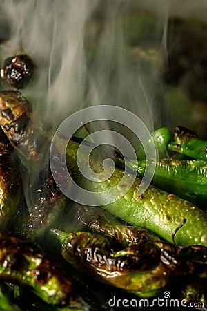 Blistered Shishito Peppers with smoke Stock Photo