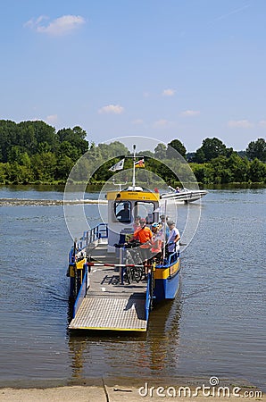 View on small passenger and bicycle ferry voet- en fietsveer on river maas in summer Editorial Stock Photo