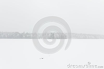 Blizzard winter landscape at frozen lake Stock Photo