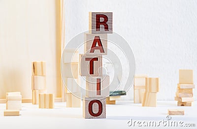 Block of alphabet letters forming the word RATIO on wooden surface. Concept of common marketing business terms. Slightly defocused Stock Photo