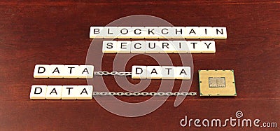 Block chain security spelled out in tiles on a cherry wood background with data and a processor chip underneath Stock Photo