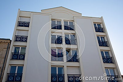 Block of flats modern white contemporary residential new building with window balcony Editorial Stock Photo