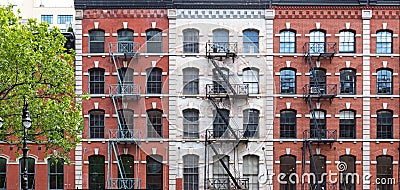 Old apartment buildings with windows and fire escapes in the Tribeca neighborhood of New York City Stock Photo