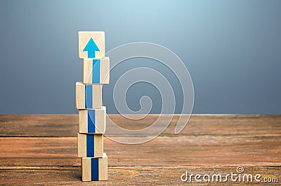 Block tower with blue arrows. Growth, development progress. Road map agreement concept. Career promotion step by step. Education, Stock Photo