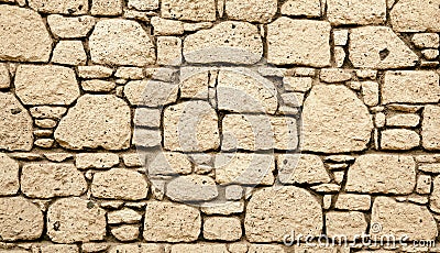 Block Wall. Obsolete Worn Vintage Stonelaying. Ancient Texture. Grunge background Sepia Toned Photo Stock Photo