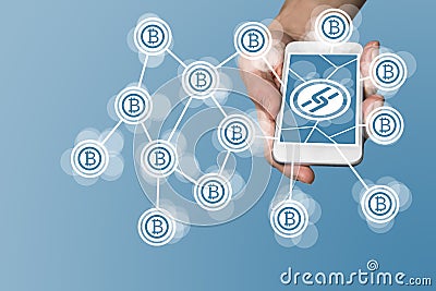 Blockchain and bitcoin concept with hand holding modern smart phone as example for fin tech technology Stock Photo