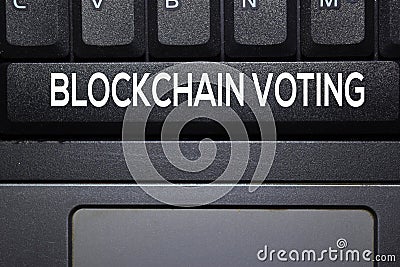 Blockchain Voting write on keyboard isolated on laptop background Stock Photo