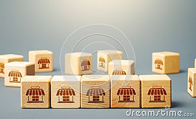 Blocks symbolizing shopping stores. Building a successful business empire. Franchise concept Stock Photo