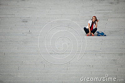 Blog style fashionable woman on stairs posing Stock Photo