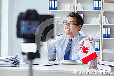 The blogger doing webcast on canadian immigration to canada Stock Photo