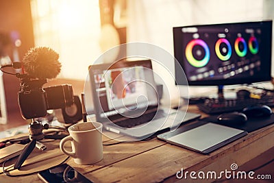 Blogger gear desktop view and Camera Laptop and Monitor Color Grading footage Stock Photo