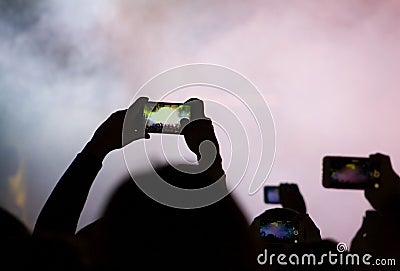 Blogger hipster using in hands gadget mobile phone, woman with backpack pointing finger on blank screen smartphone on background Stock Photo