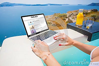 Blogger writing blogs about her travel experience Stock Photo