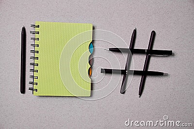 Blogging, blog and blogger or social media concept: notepad and hashtag symbol on grey background Stock Photo