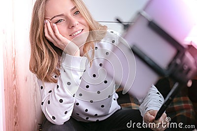 Blogging. Blonde girl blogger Technology internet and happiness concept. Young woman funny girl taking self picture Stock Photo