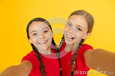 Blogging modern trend. Personal blog. Capturing moments. Child girls taking photo. Children kids happy faces. Video call Stock Photo