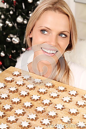 Blond angel with cookies Stock Photo