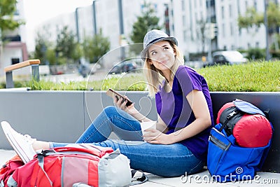 Blond backpacker woman traveling alone Stock Photo
