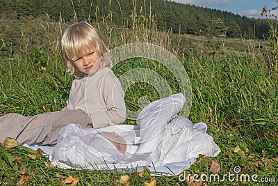 A blond boy with younger newborn brother Stock Photo