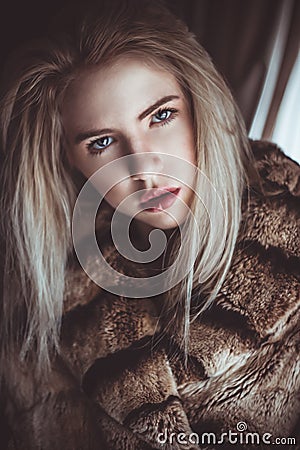 Blond girl with a cold stare Stock Photo