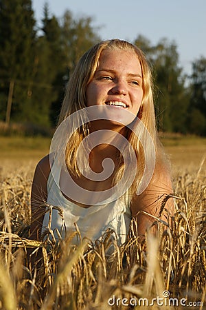 Blond girl enjoying the evening sunlight Stock Photo