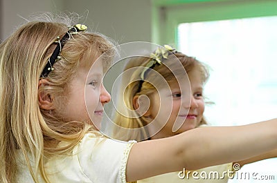 Blond girl reflection in mirror Stock Photo