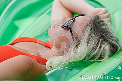 Blond girl sun bathing Stock Photo