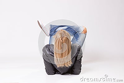 Blond hair, mature woman lying on floor back Stock Photo