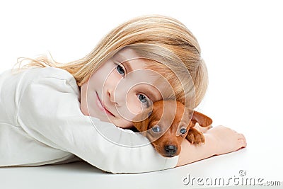 Blond kid girl with mini pinscher pet mascot dog Stock Photo