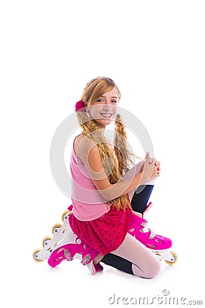 Blond pigtails roller skate girl on her knees happy Stock Photo