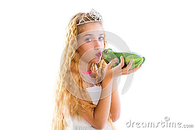 Blond princess girl kissing a frog green toad Stock Photo