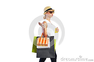 Blond shopaholic woman bags and smartphone Stock Photo