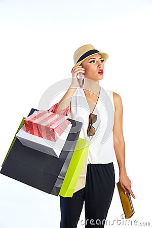 Blond shopaholic woman bags and smartphone Stock Photo