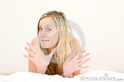 Blond teenage girl gesturing Stock Photo