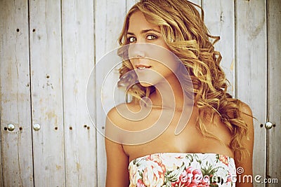 Blond woman standing outdoors Stock Photo