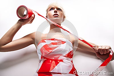 blond woman with warning tape Stock Photo