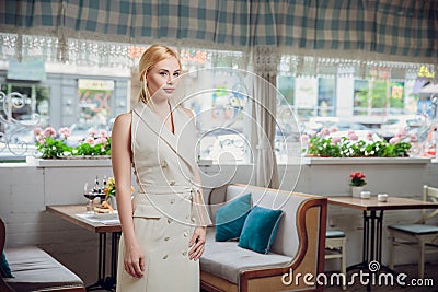 Blonde beautifull businesswoman posing in a restaurant Stock Photo