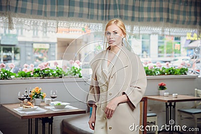 Blonde beautifull businesswoman posing in a restaurant Stock Photo