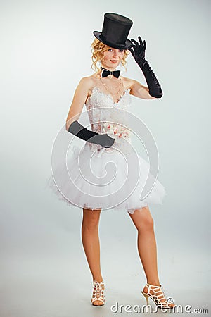 Blonde bride in tophat with veil and long black gloves Stock Photo